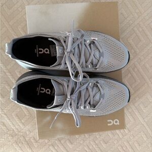 On Running Athletic Shoes in Light Gray